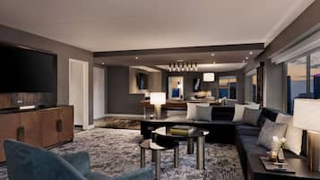 A modern living room with a sofa, coffee table, and TV.