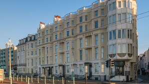 A large, historic hotel building with multiple stories and a classic architectural style. - Queens Hotel (Brighton)