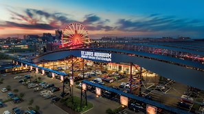 A large parking lot with a Ferris wheel and a sign for St. Louis Aquarium at Union Station. - Hilton St. Louis at the Ballpark (St. Louis)