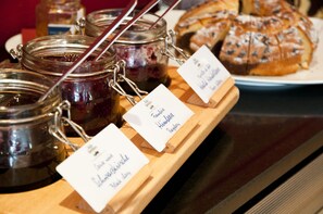 Freshly baked goods and artisanal preserves on display.