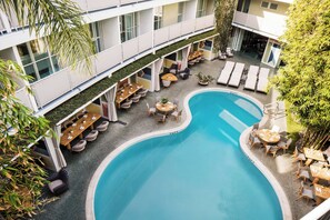 Outdoor pool, open 9 AM to 8:00 PM, pool umbrellas, pool loungers