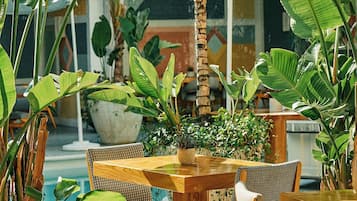 Breakfast, lunch, dinner served; international cuisine, pool views