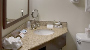 A bathroom with a sink, mirror, and toiletries. - Crowne Plaza Cleveland Airport by IHG (Middleburg Heights)