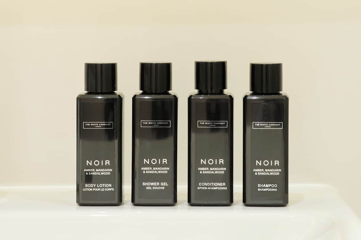 hair dryer, towels, soap, shampoo