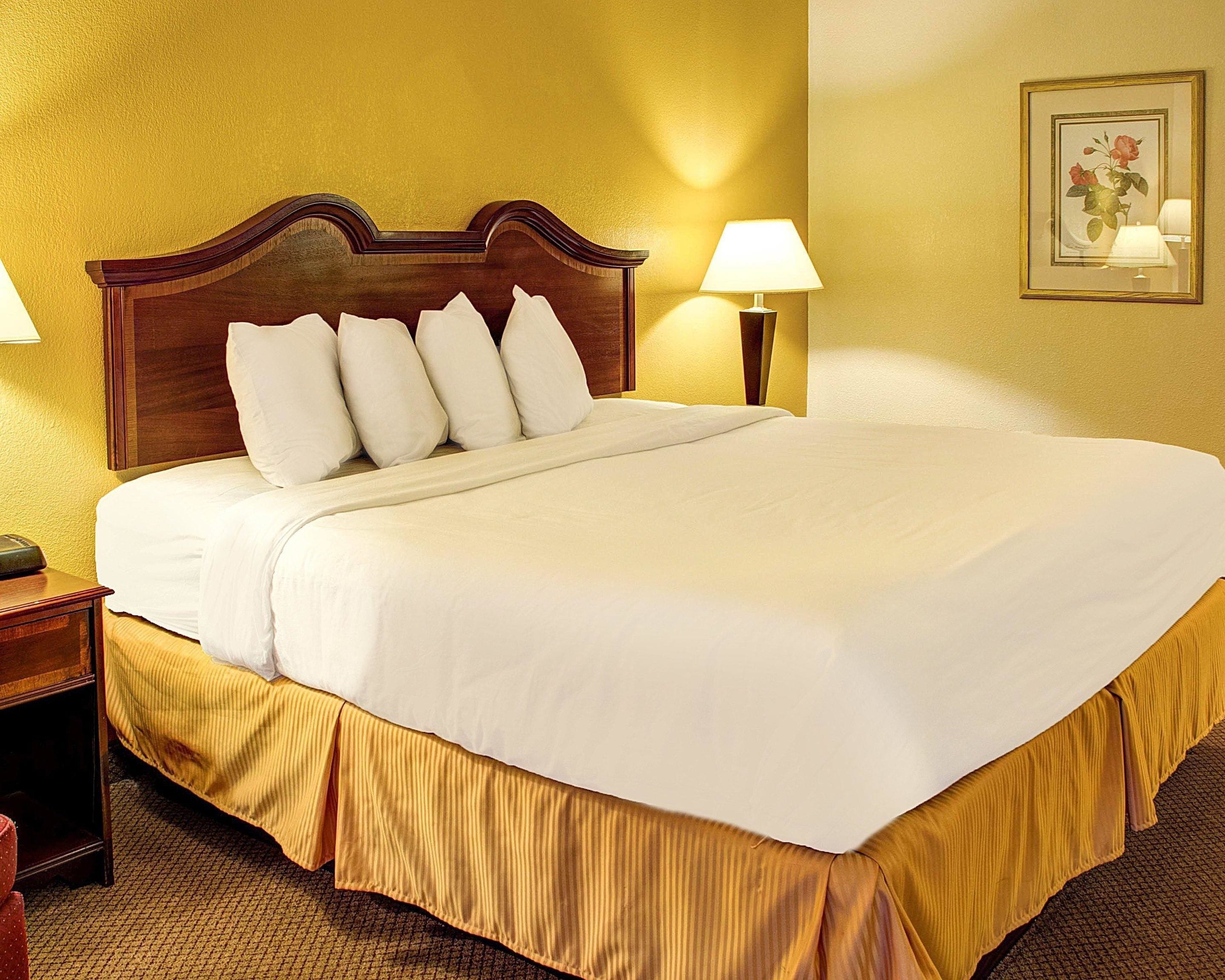 Desk, laptop workspace, blackout drapes, iron/ironing board