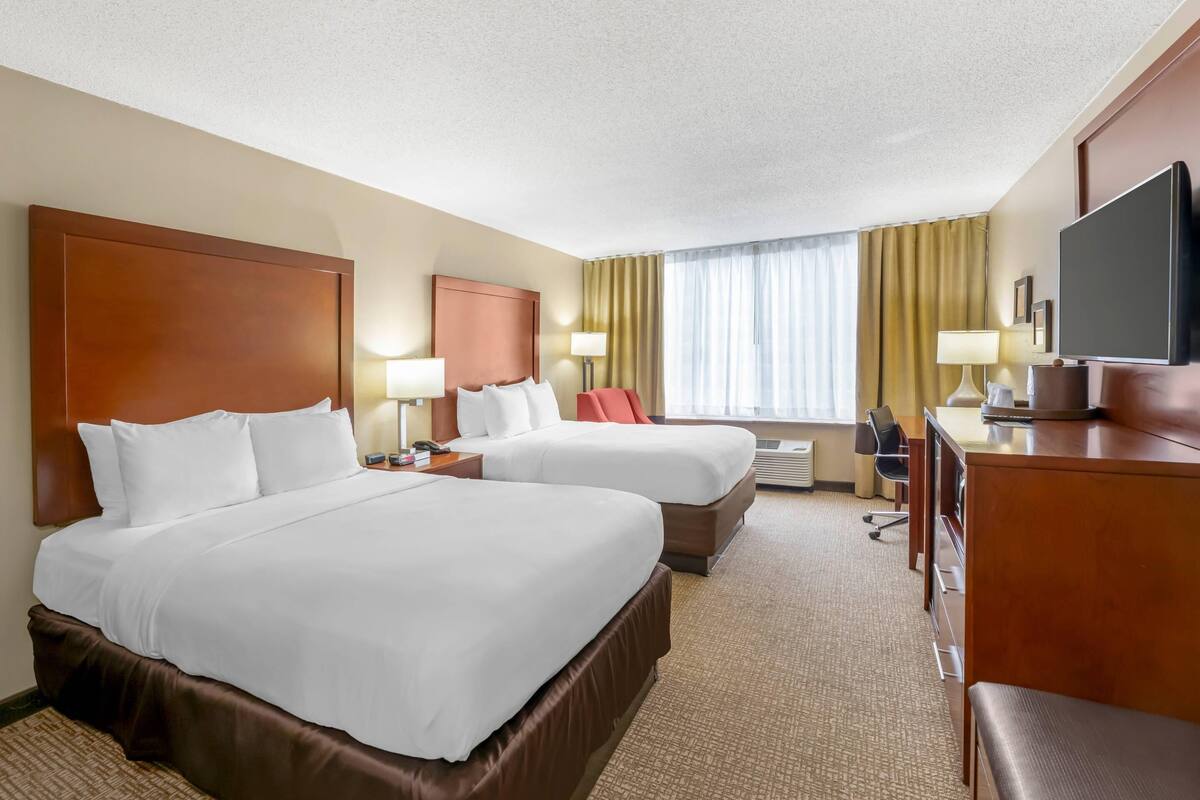 Premium bedding, pillow-top beds, desk, laptop workspace