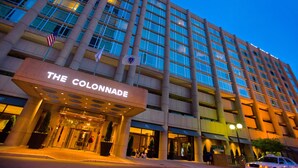 A multi-story hotel with a prominent entrance labeled "THE COLONNADE."