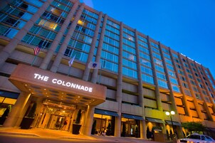 A multi-story hotel with a prominent entrance labeled "THE COLONNADE."