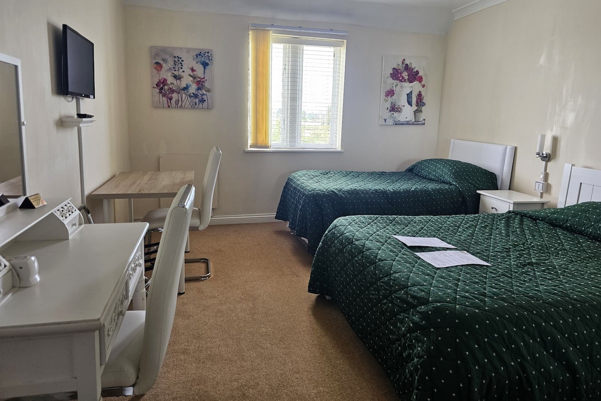 Desk, laptop workspace, blackout curtains, soundproofing