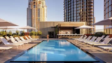Outdoor pool, open 6:00 AM to 10:00 PM, pool umbrellas, sun loungers