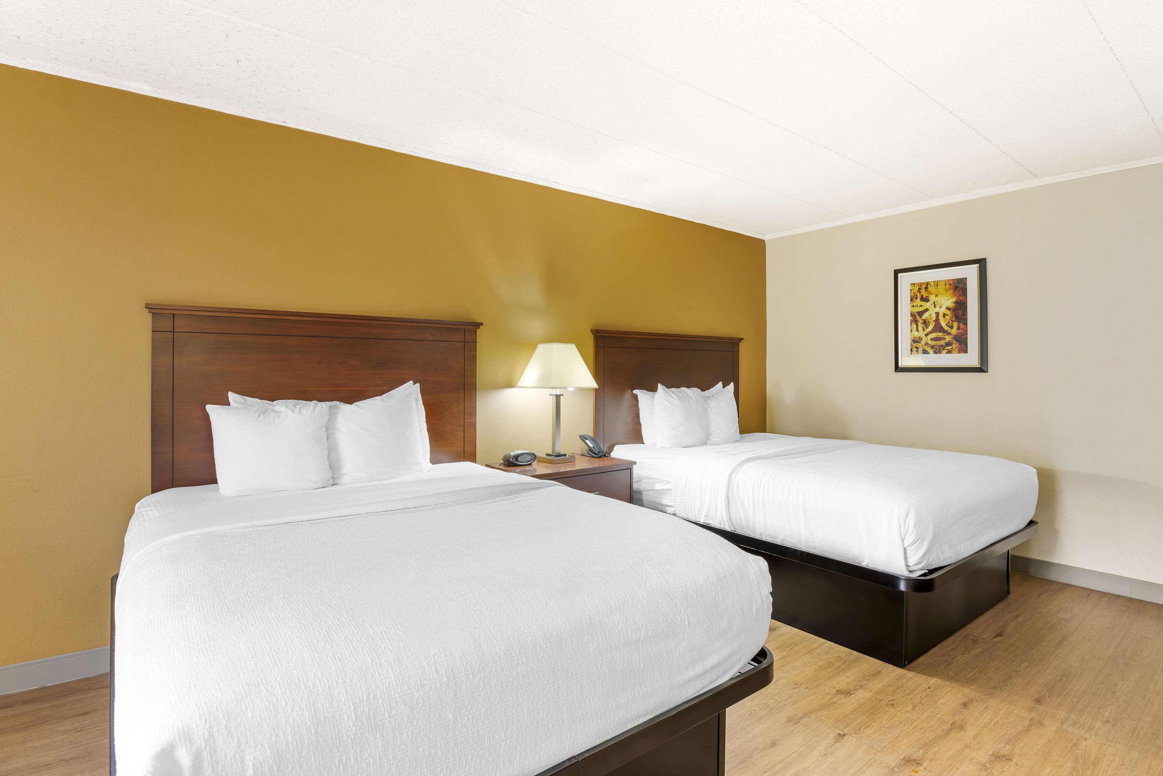 standard room, 2 queen beds, non smoking, microwave | in-room safe, desk, laptop workspace, blackout curtains