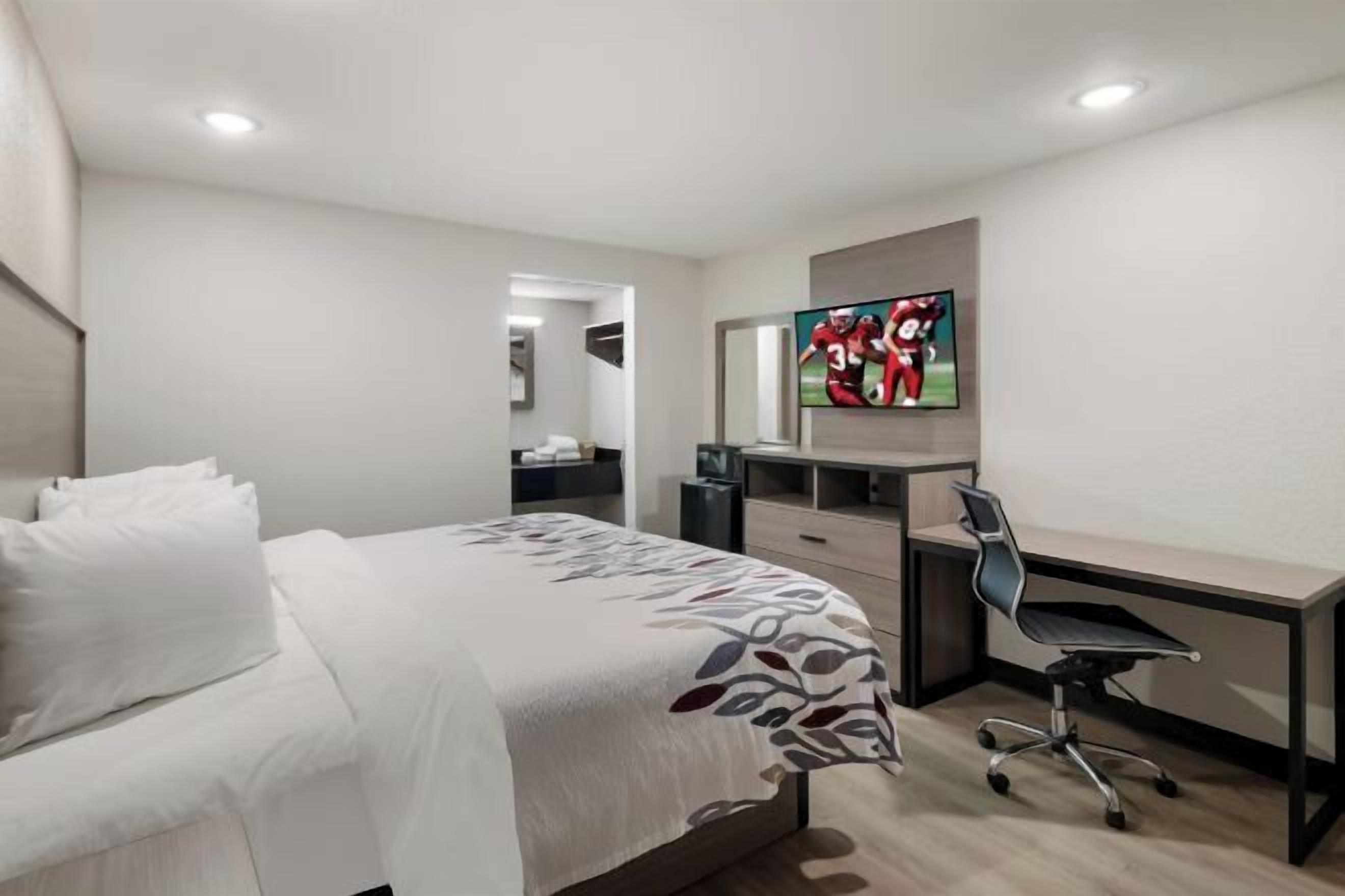 Desk, laptop workspace, blackout drapes, iron/ironing board