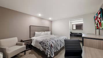 Desk, laptop workspace, blackout drapes, iron/ironing board