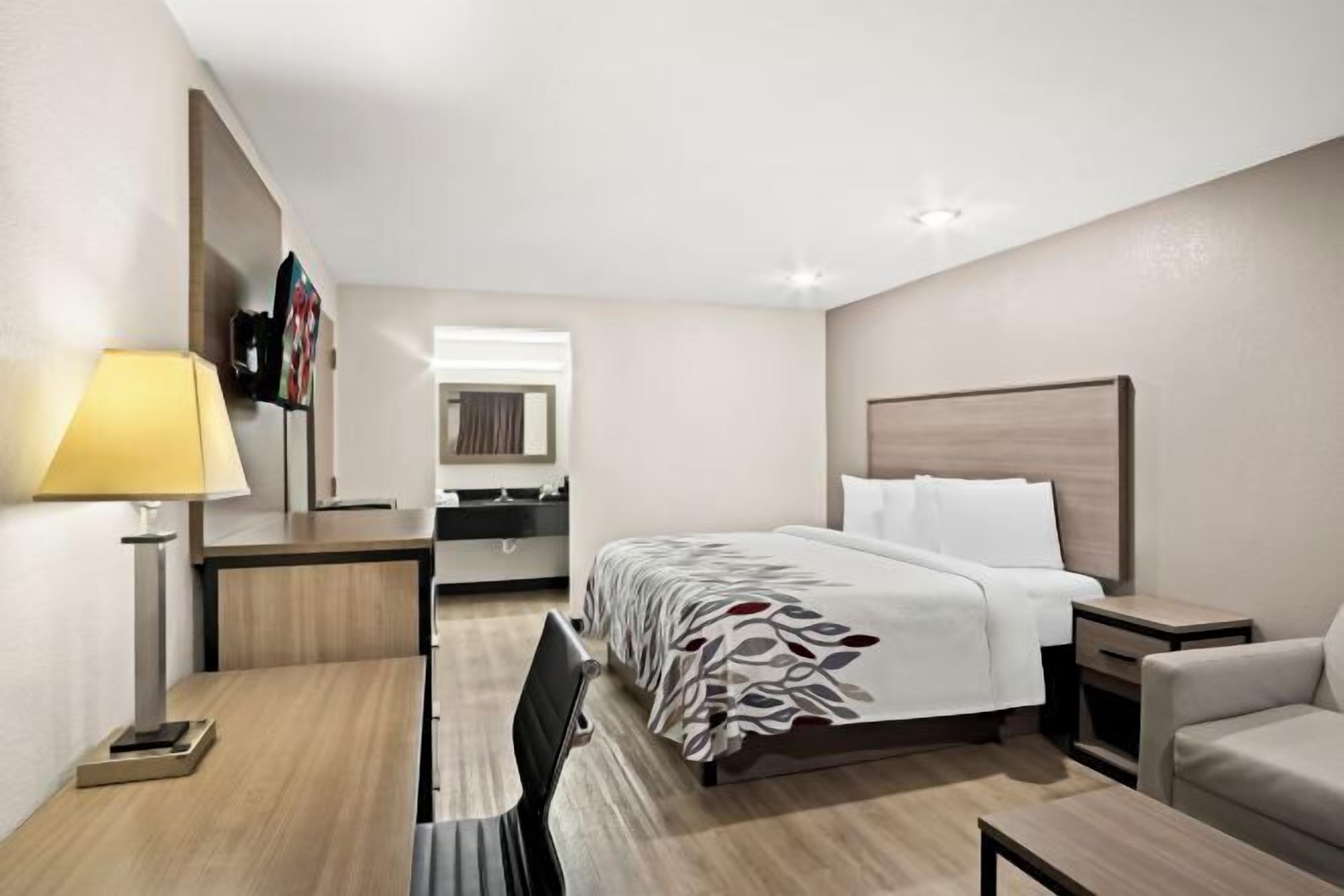 Desk, laptop workspace, blackout drapes, iron/ironing board