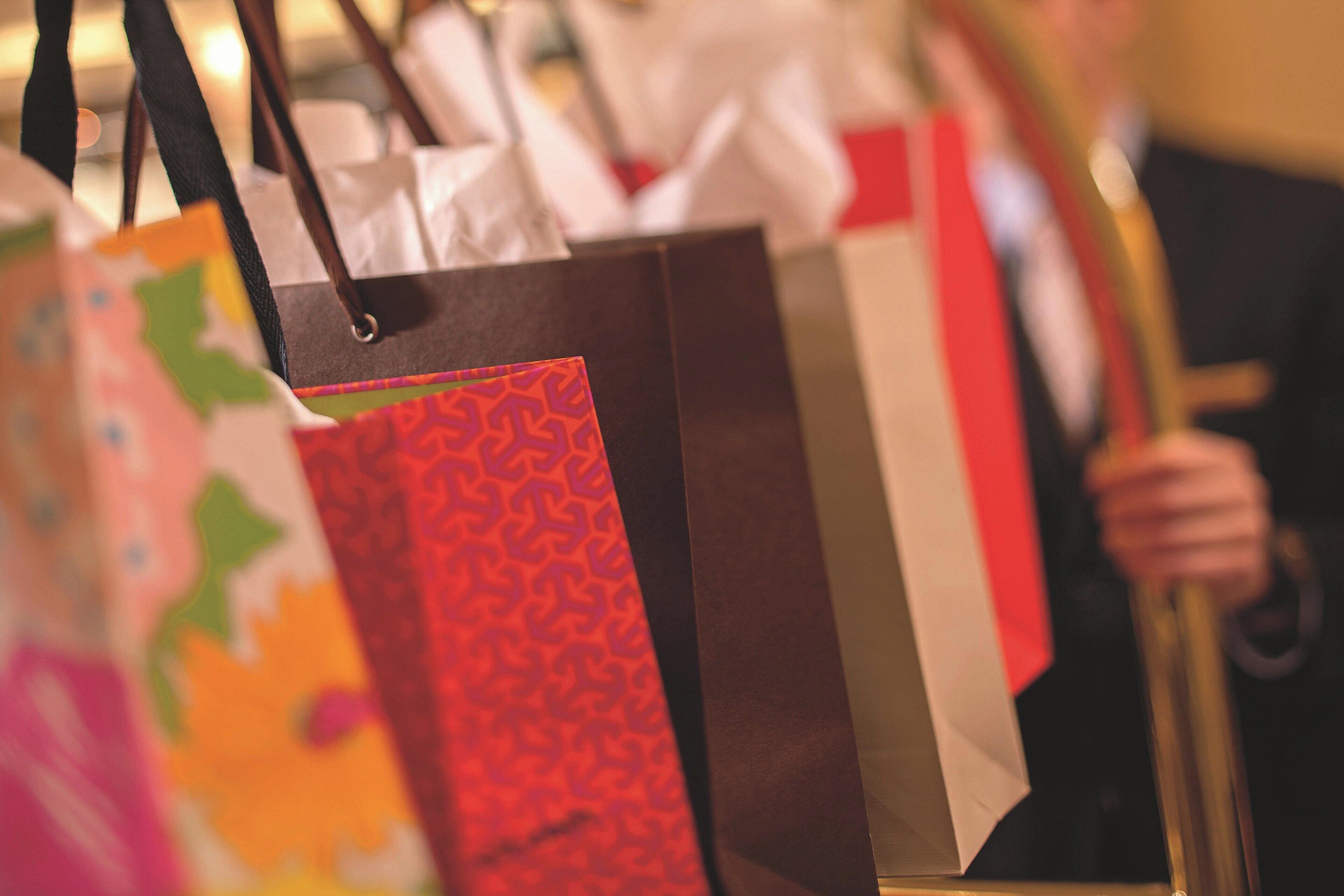 A close-up of shopping bags with various patterns and colors.