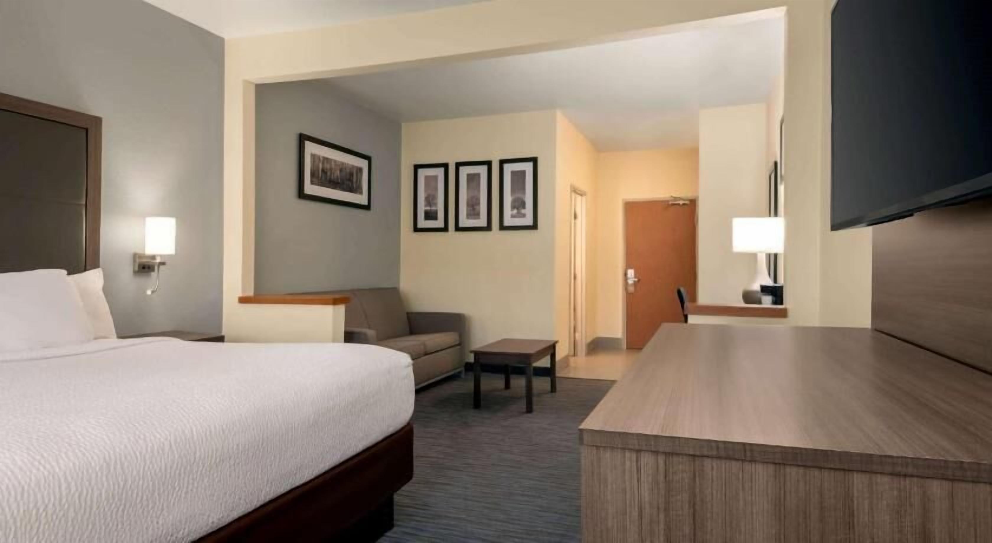 Premium bedding, pillow-top beds, desk, laptop workspace