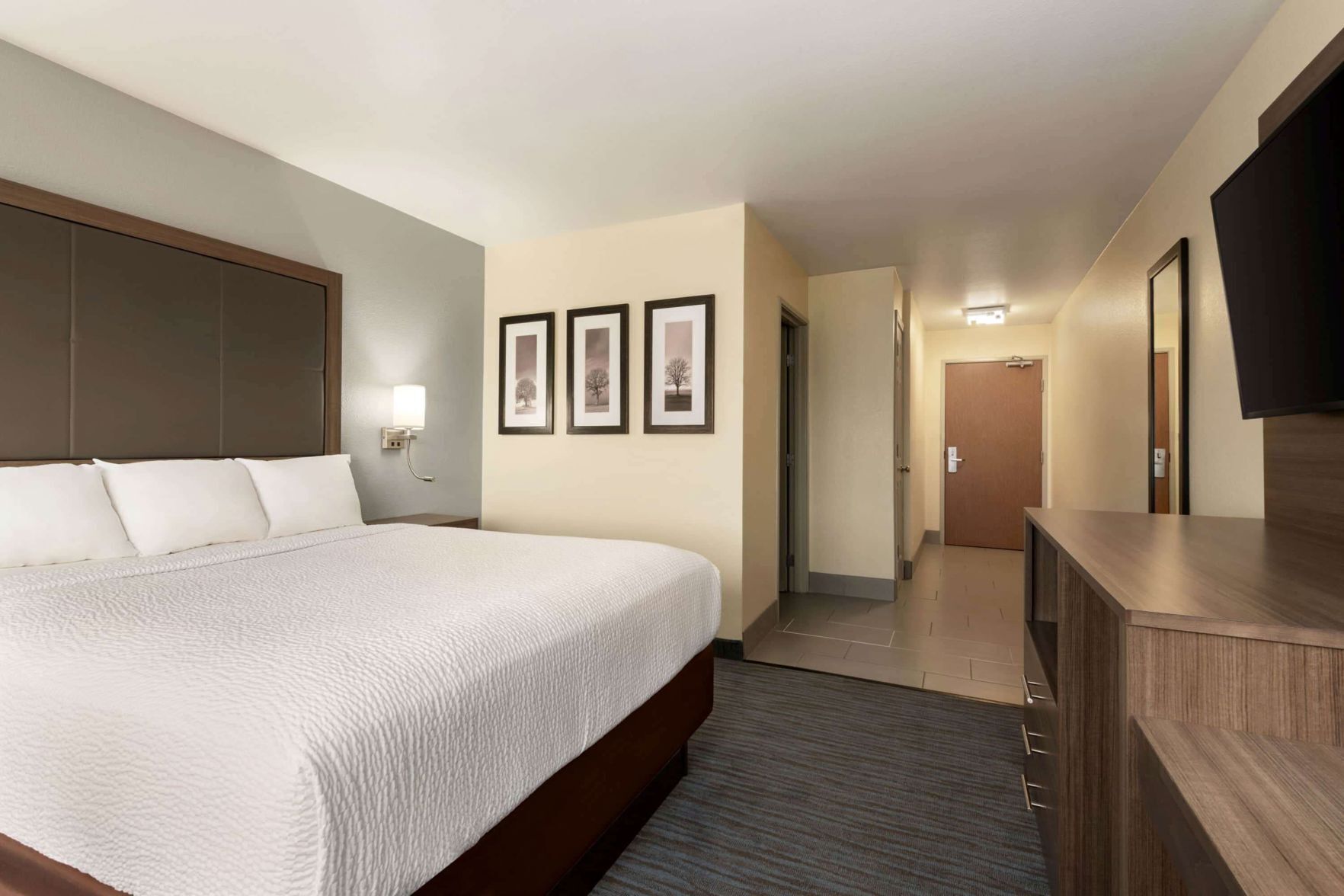 Premium bedding, pillow-top beds, desk, laptop workspace