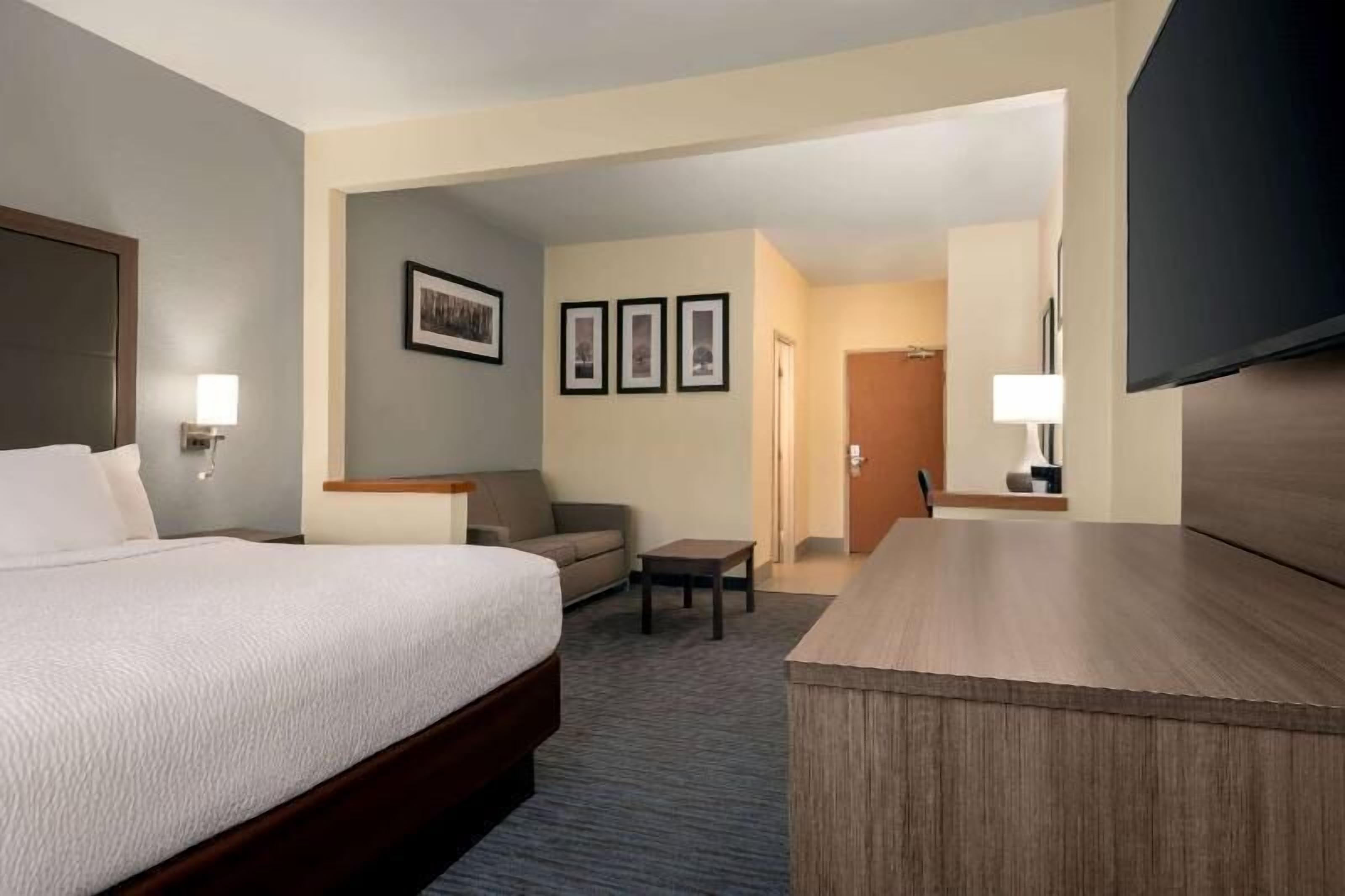 Premium bedding, pillow-top beds, desk, laptop workspace