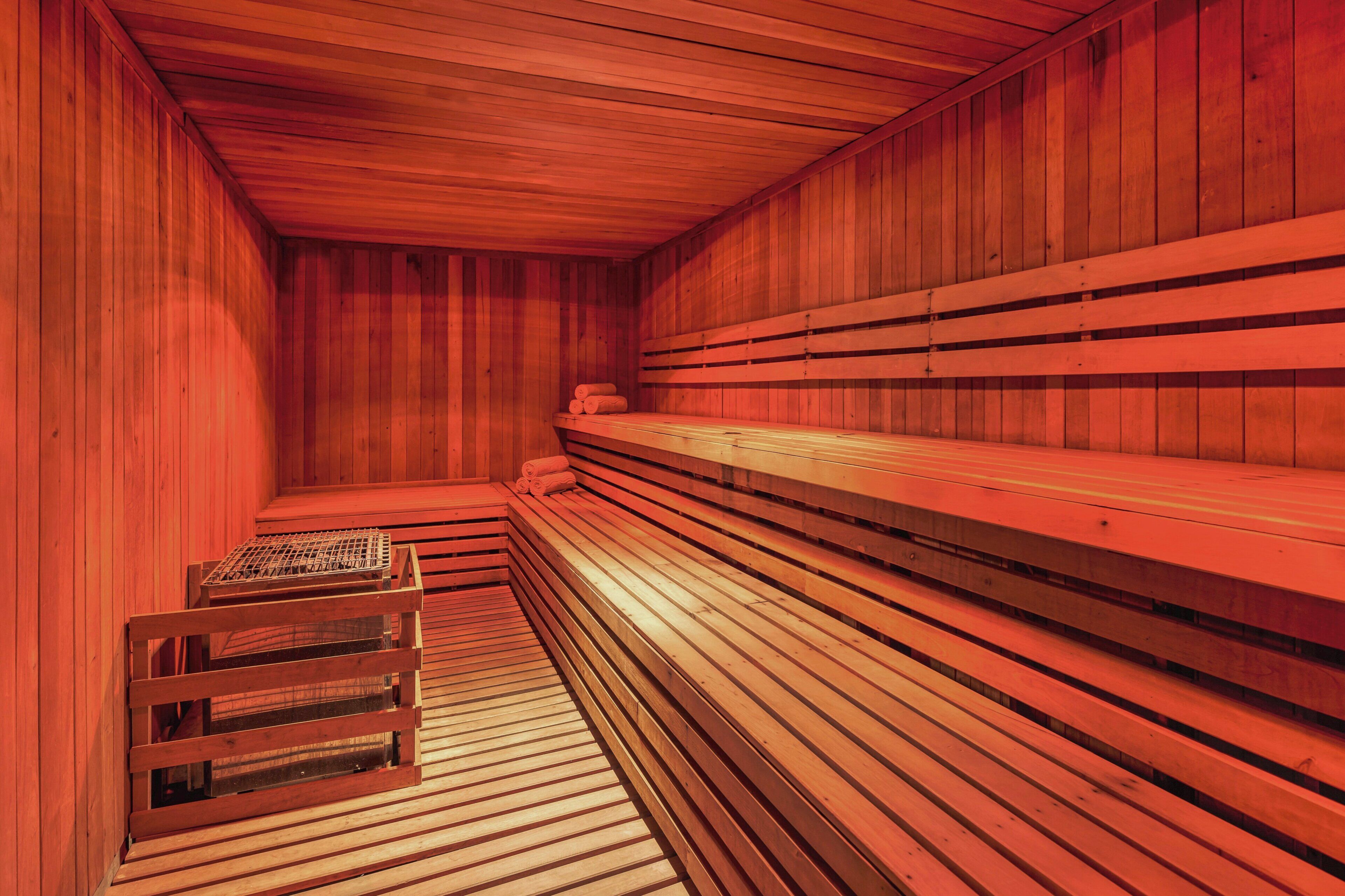 A sauna with wooden benches and a bench seat.