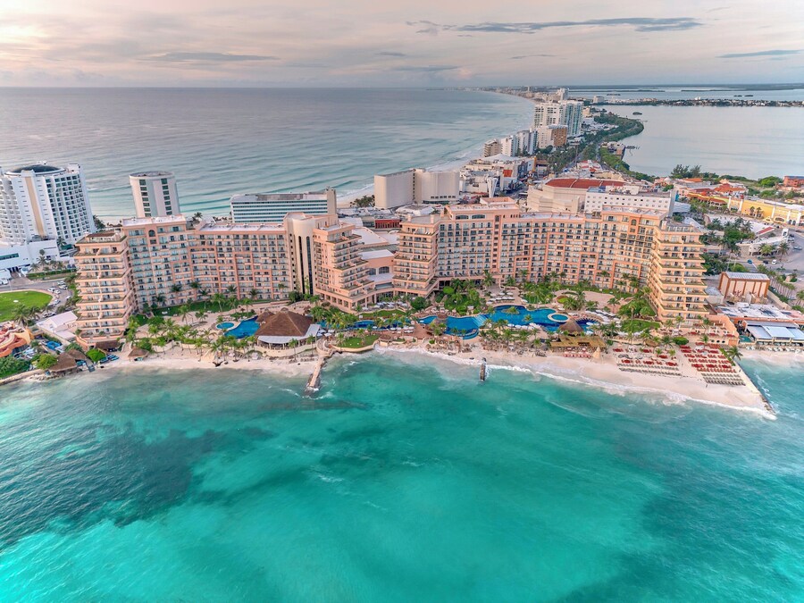 Secluded Playa Coral beach with calm waters and eco-friendly vibe in Cancun, Mexico.
