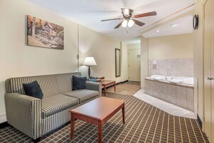 Suite, 1 King Bed, Non Smoking, Jetted Tub (with Sofabed) | Desk, laptop workspace, iron/ironing board, WiFi