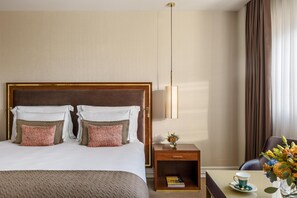 Hypo-allergenic bedding, down comforters, minibar, in-room safe