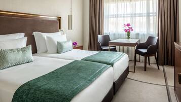 Deluxe Room | Hypo-allergenic bedding, down comforters, minibar, in-room safe