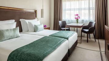 Deluxe Room | Hypo-allergenic bedding, down comforters, minibar, in-room safe