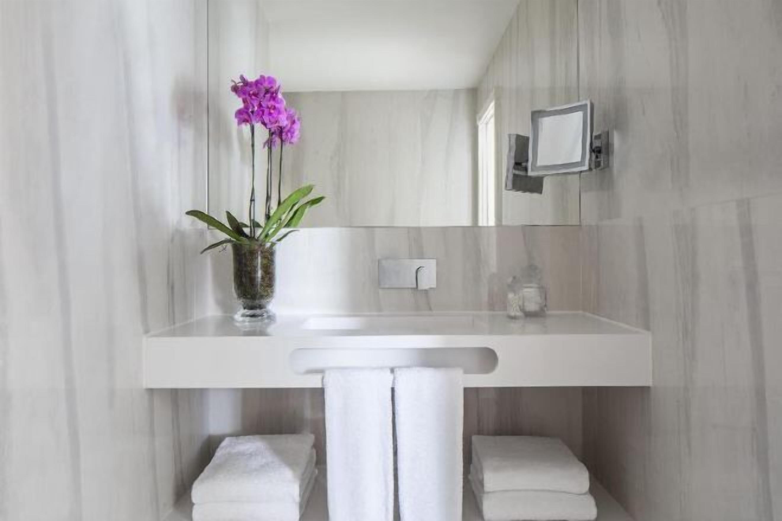 Bathroom | Eco-friendly toiletries, hair dryer, bathrobes, slippers