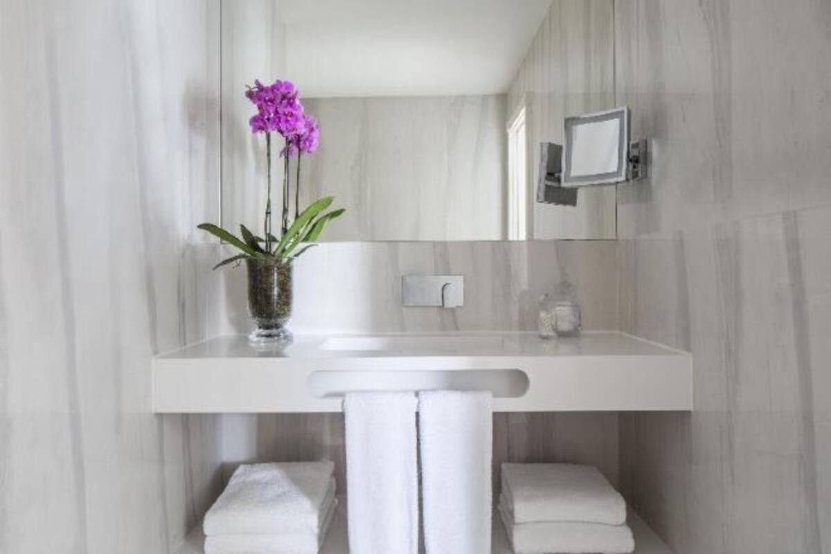 Bathroom | Eco-friendly toiletries, hair dryer, bathrobes, slippers