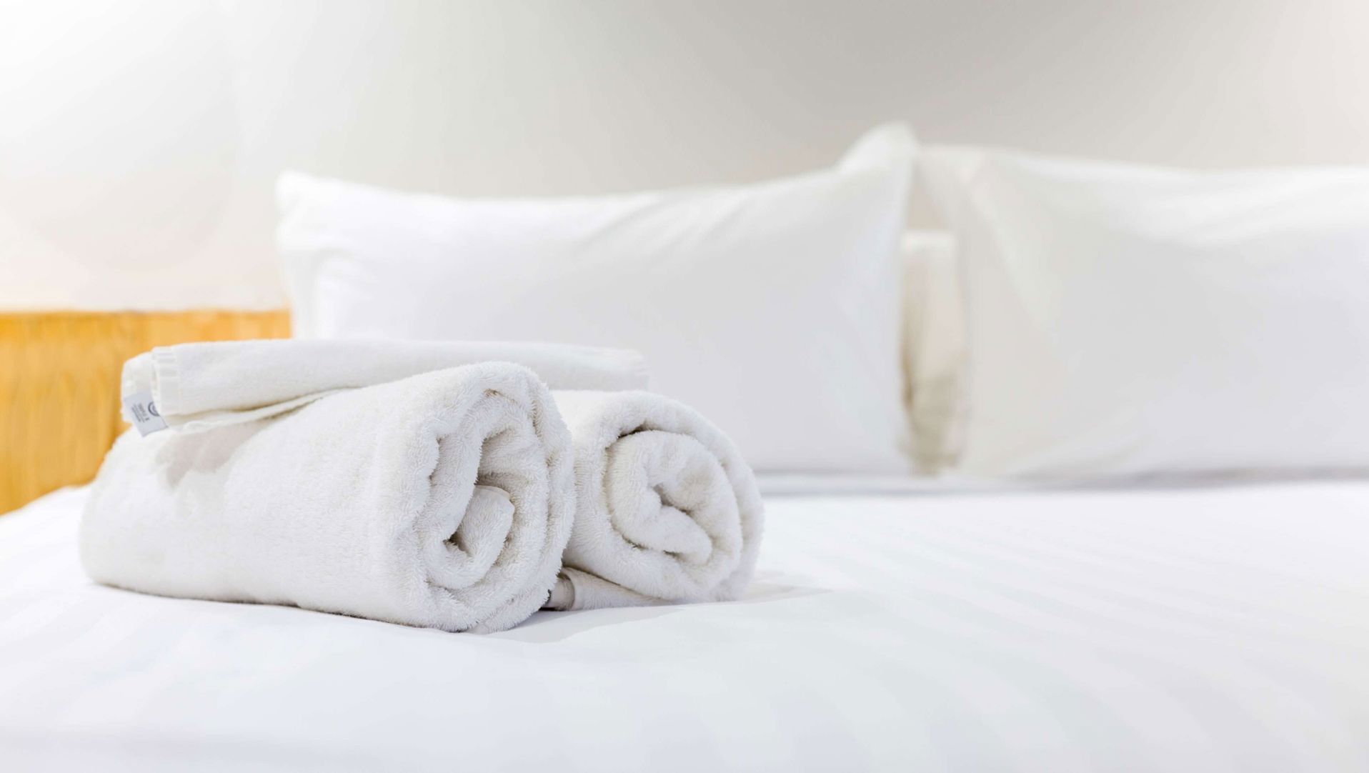 Premium bedding, desk, laptop workspace, blackout curtains