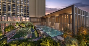 A modern hotel with a pool, lush greenery, and a view of a tall building. - Waldorf Astoria Kuala Lumpur (Kuala Lumpur)