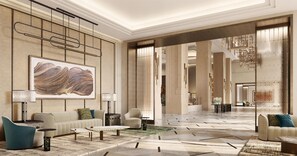 A spacious lobby with a high ceiling, a large abstract painting, and a modern chandelier. - Waldorf Astoria Kuala Lumpur (Kuala Lumpur)