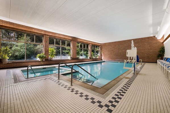 Relax by the pool surrounded by lush views and comfortable lounge chairs.