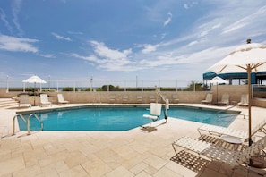 Seasonal outdoor pool, open 8:00 AM to 8:00 PM, pool umbrellas