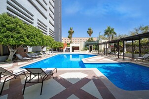 Outdoor pool, pool umbrellas, sun loungers