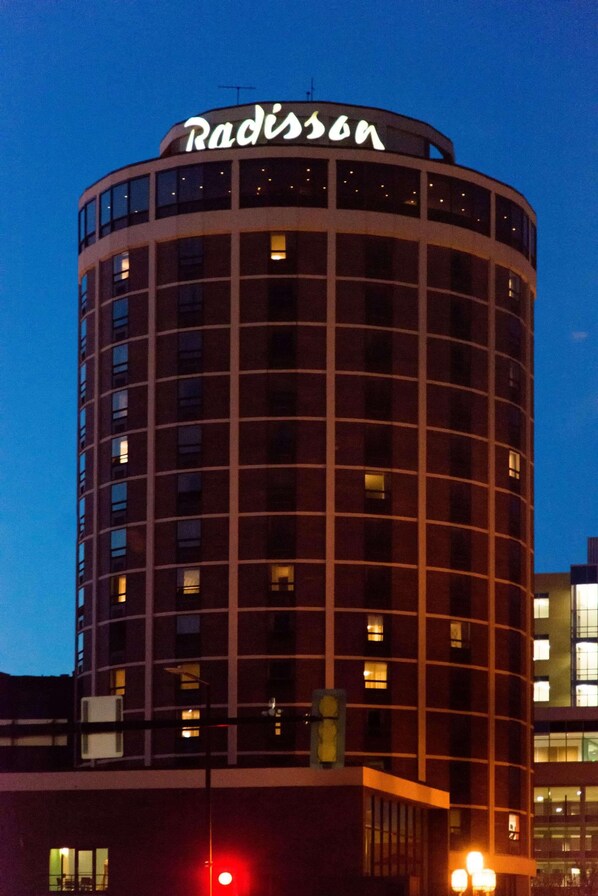 Experience the sleek, modern design of our hotel's exterior, featuring a grid-like pattern of windows.