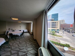 Enjoy a city view from the comfort of this cozy room, featuring a dining area, seating area, and a single bed.