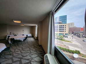 Enjoy a city view from the comfort of this cozy room, featuring a dining area, seating area, and a single bed.
