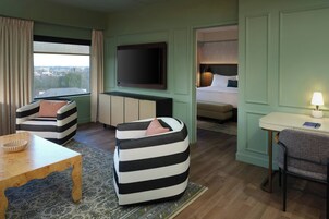 Premium bedding, desk, laptop workspace, soundproofing