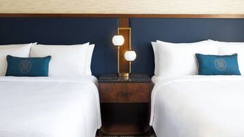 Premium bedding, desk, laptop workspace, iron/ironing board