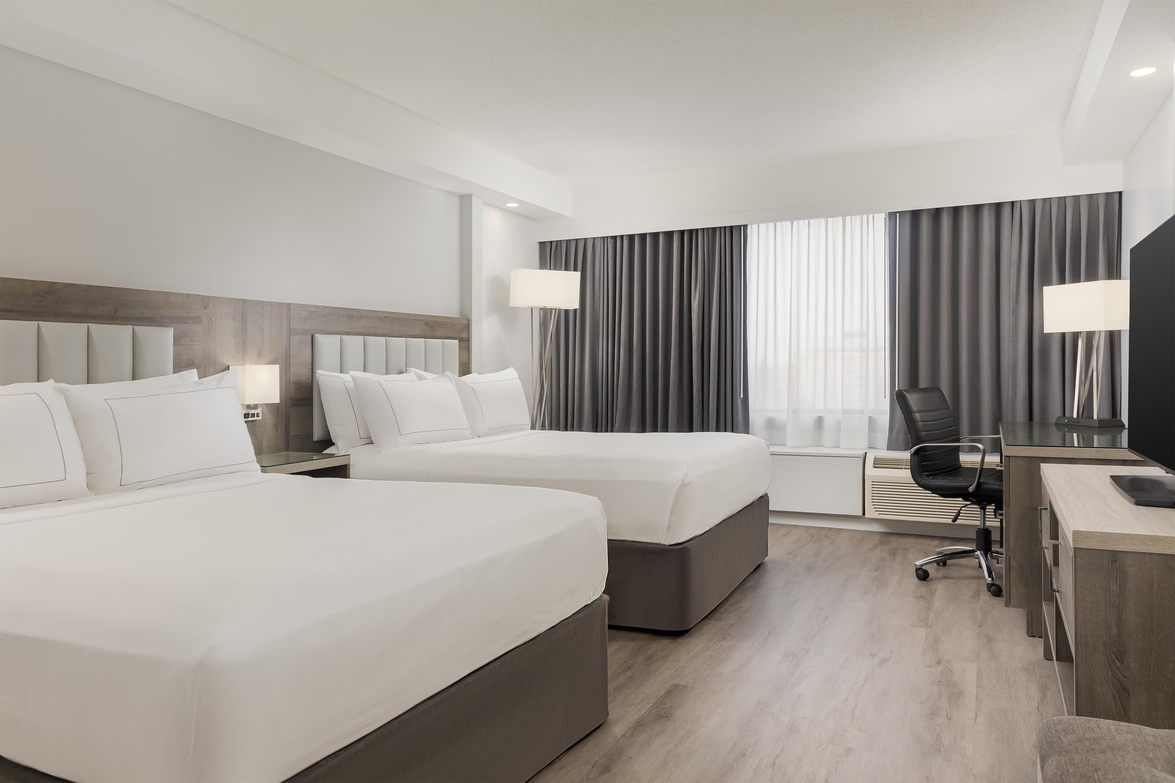 Suite, 2 Queen Beds (Living Room) | Premium bedding, down comforters, pillowtop beds, in-room safe