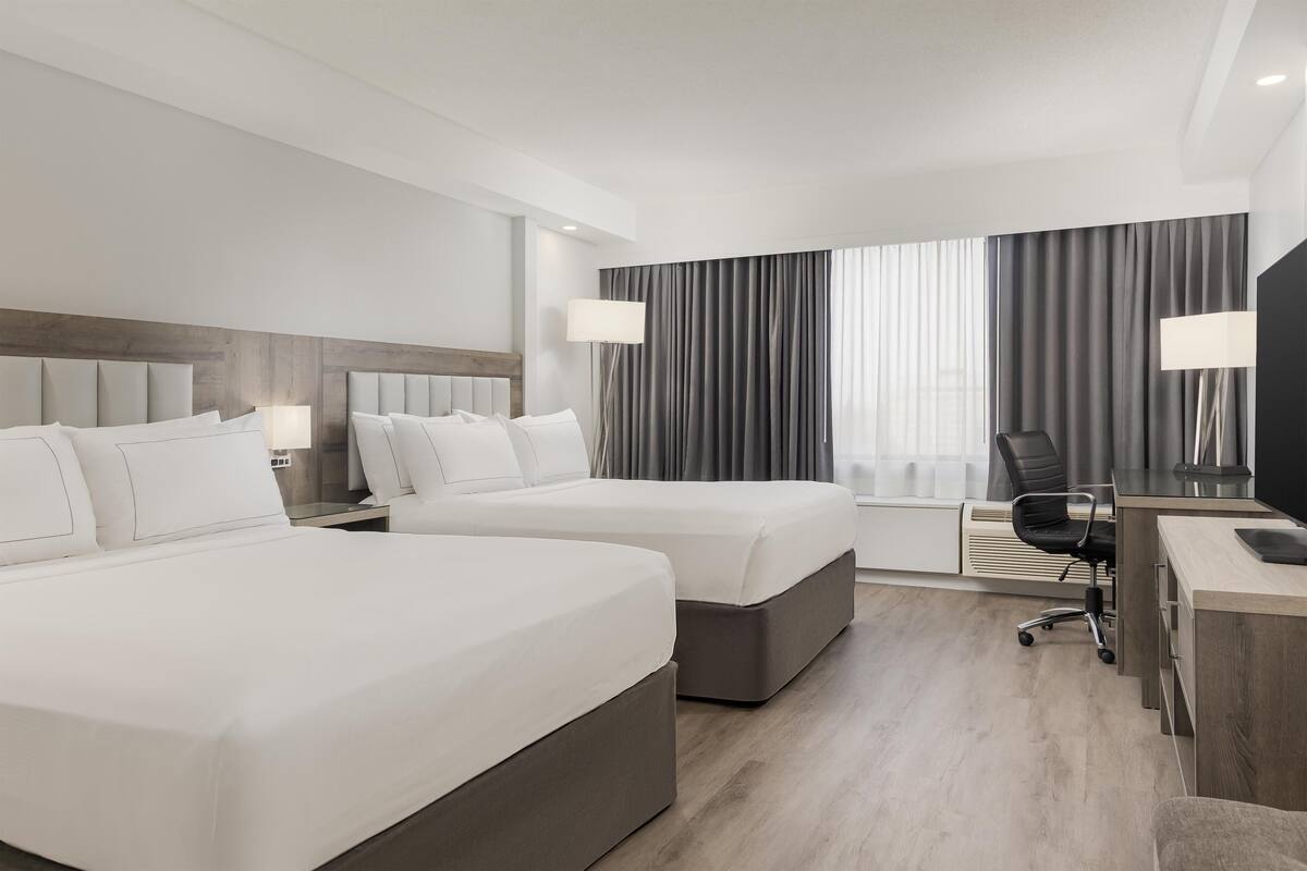 Suite, 2 queensize-senger (Living Room) | Sengetøy av topp kvalitet, dundyner og senger med overmadrass