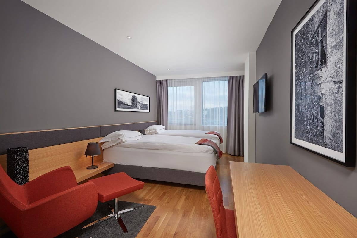 Premium bedding, desk, blackout drapes, soundproofing