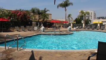 Outdoor pool, open 7:00 AM to 10:00 PM, pool umbrellas, sun loungers