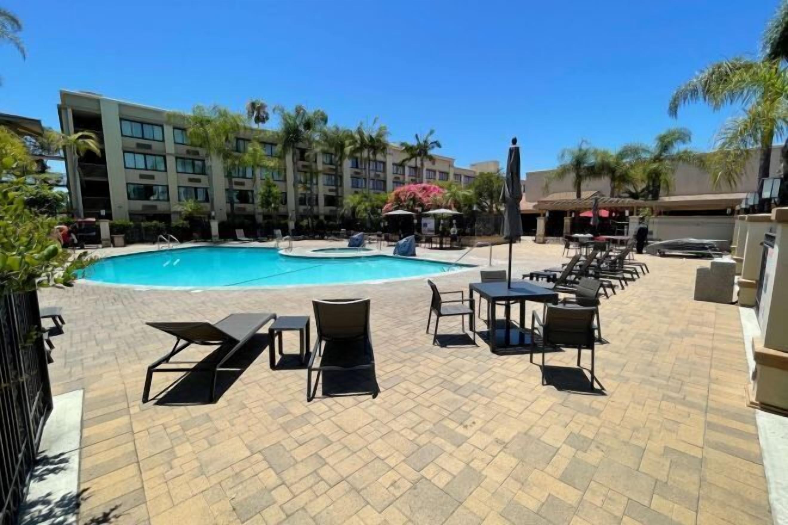 Pool | Outdoor pool, open 7:00 AM to 10:00 PM, pool umbrellas, sun loungers