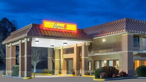 A Super 8 hotel with a covered entrance, multiple floors, and a prominent 'Super 8' sign.