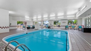 An indoor swimming pool with a tiled floor, a pool ladder, and a 'NO DIVING' sign. - MainStay Suites Appleton Airport - Fox River Mall Area (Appleton)
