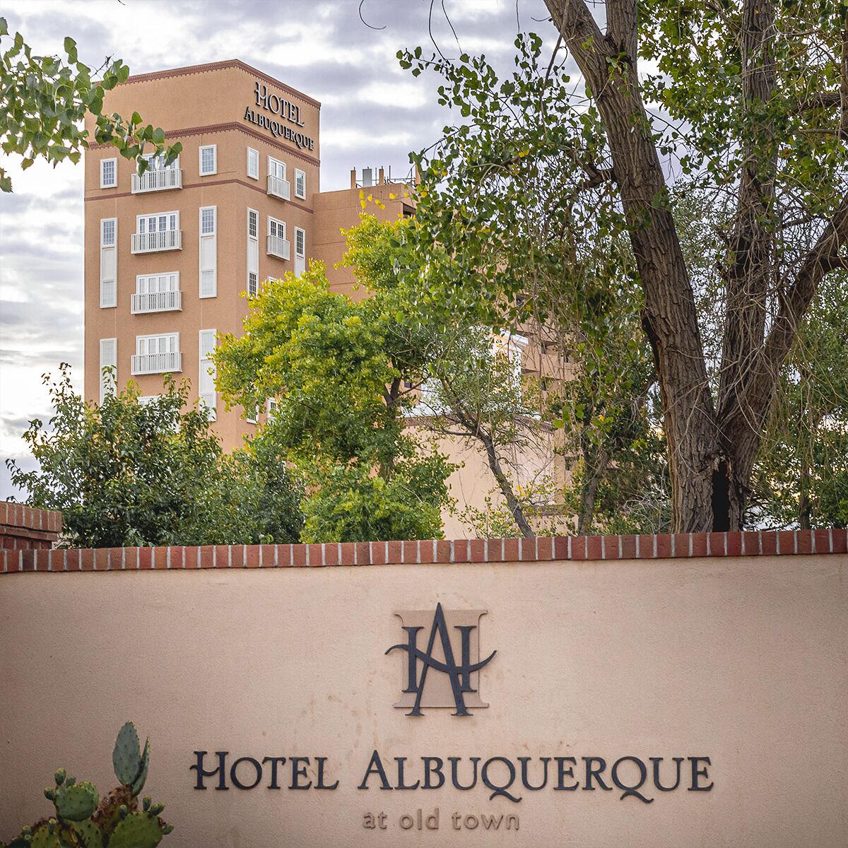 A building with a sign that reads 'Hotel Albuquerque at Old Town.'