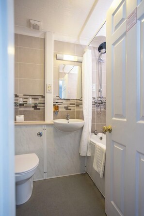 Standard Room, 1 King Bed, Non Smoking | Bathroom | Free toiletries, hair dryer, towels